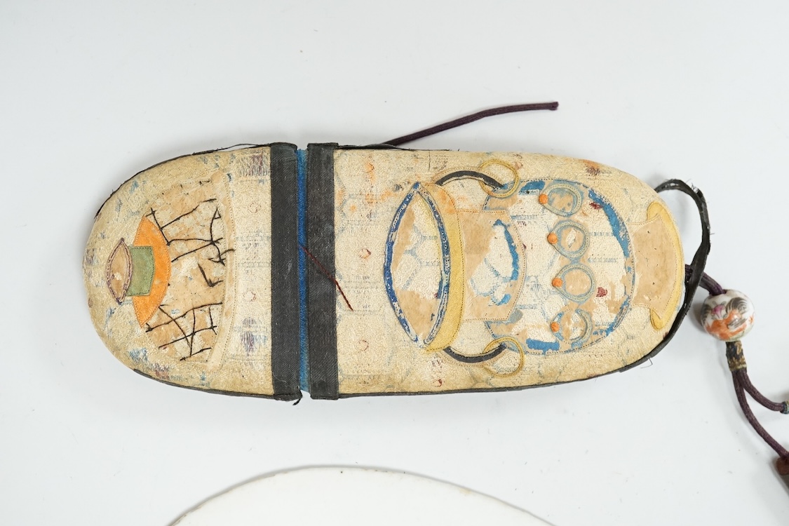 A Chinese embroidered spectacles case and an armorial oval miniature dish